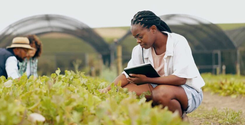 Agriculture researcher with notepad.